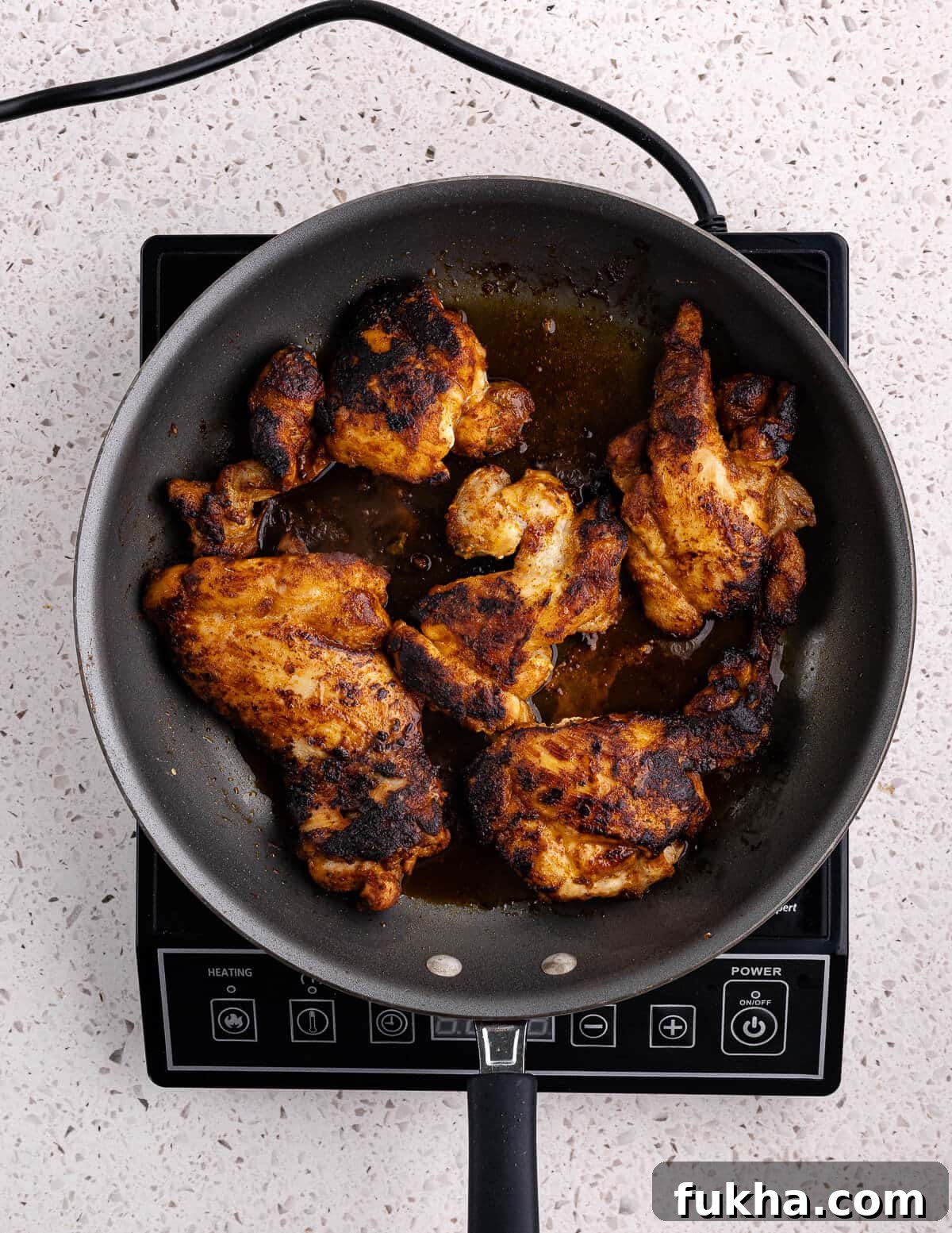 caramelized chicken thighs in a skillet 