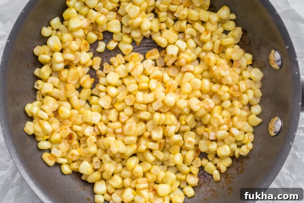 Smoky Charred Corn on the Cob Recipe 5 corn cooking in a frying pan