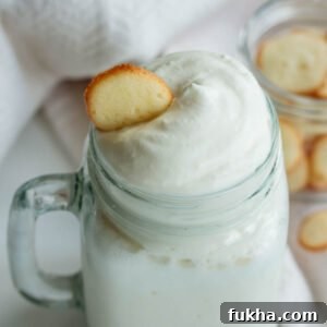 vanilla frappuccino with whipped cream and a vanilla cookie