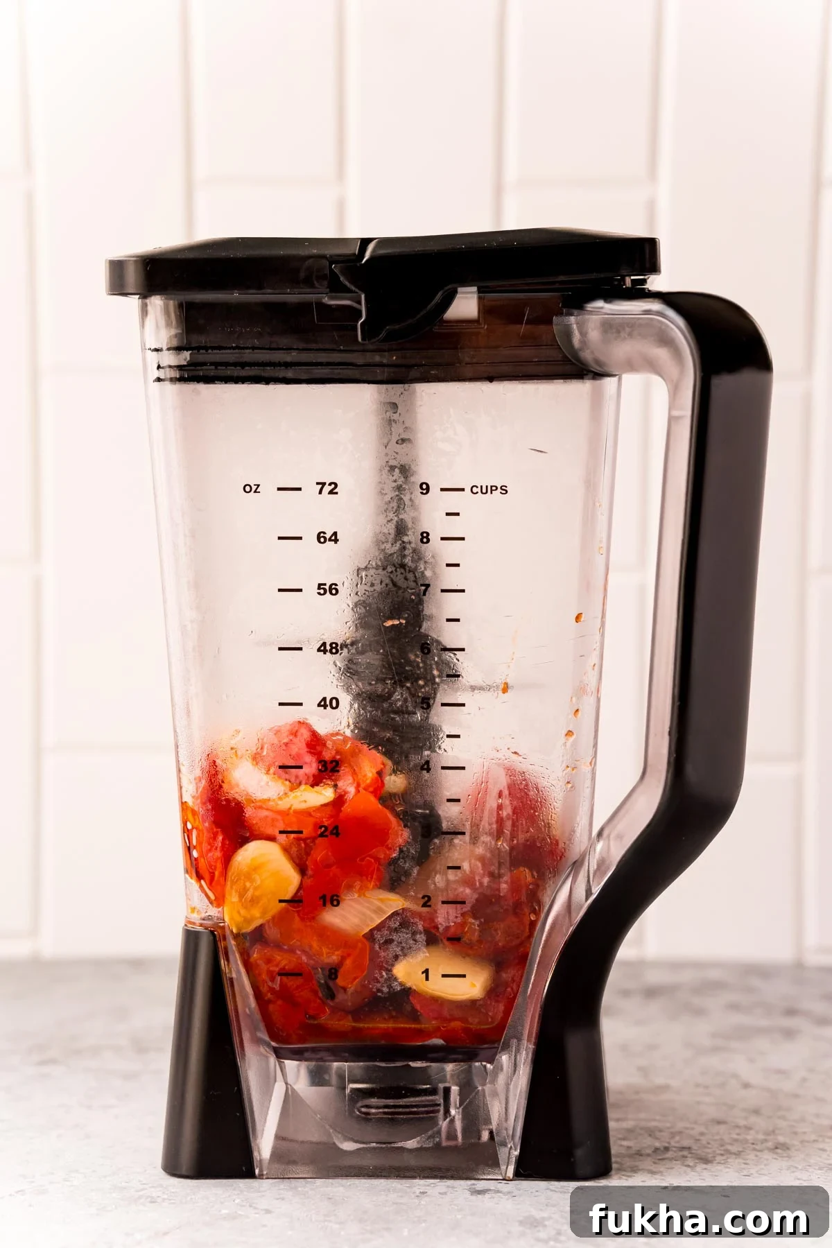 Roasted tomatoes and onions in a blender.