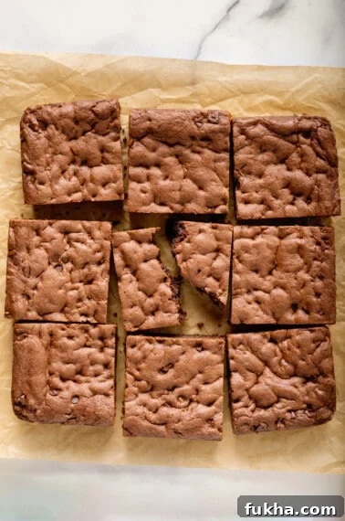 Fudgy Oreo-Stuffed Brownies Recipe 12 Cake mix brownies on top of parchment paper.