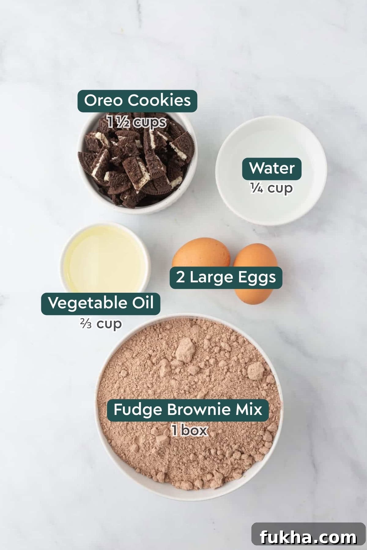 Fudgy Oreo-Stuffed Brownies Recipe 4 Ingredients for Oreo brownies, including Oreos, water, eggs, oil, and brownie mix.