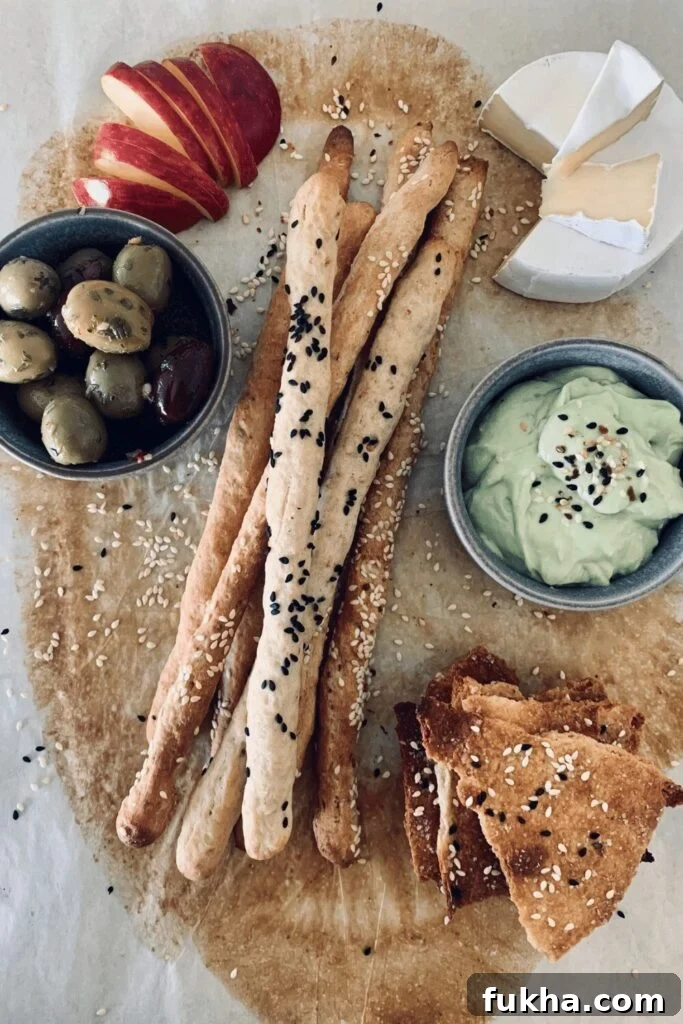 A charcuterie platter with sourdough grissini and sourdough lavosh.