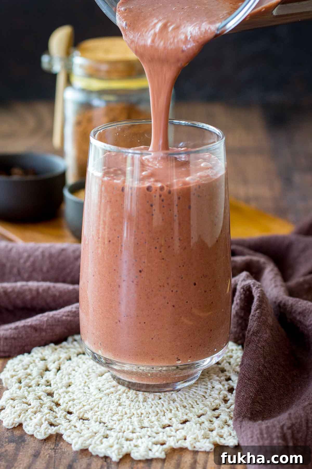 Creamy Cherry Chocolate Smoothie Recipe 5 Pouring Cherry Chocolate Smoothie in a glass