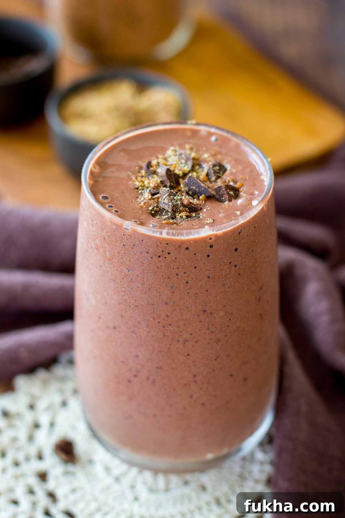 Creamy Cherry Chocolate Smoothie Recipe 7 Cherry Chocolate Smoothie served in a glass topped with dark chocolate