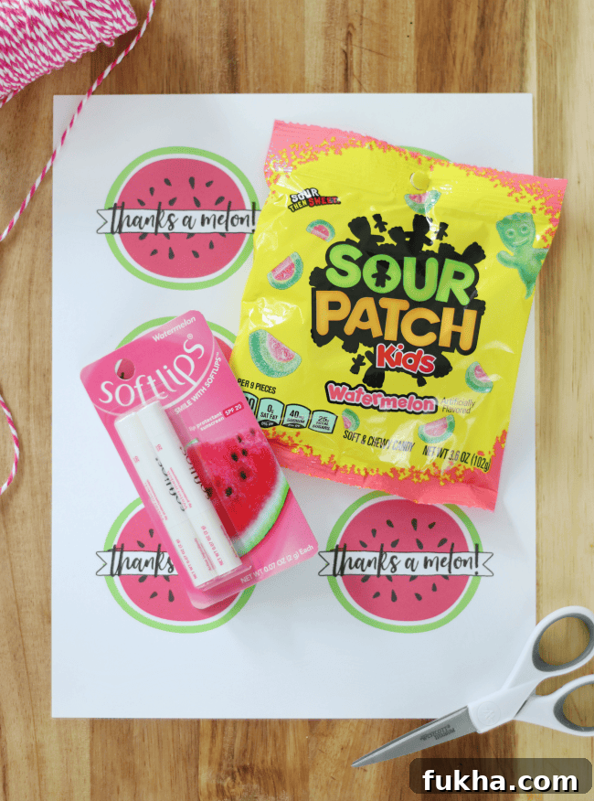 sheet of printable tags with lip gloss and candy on table