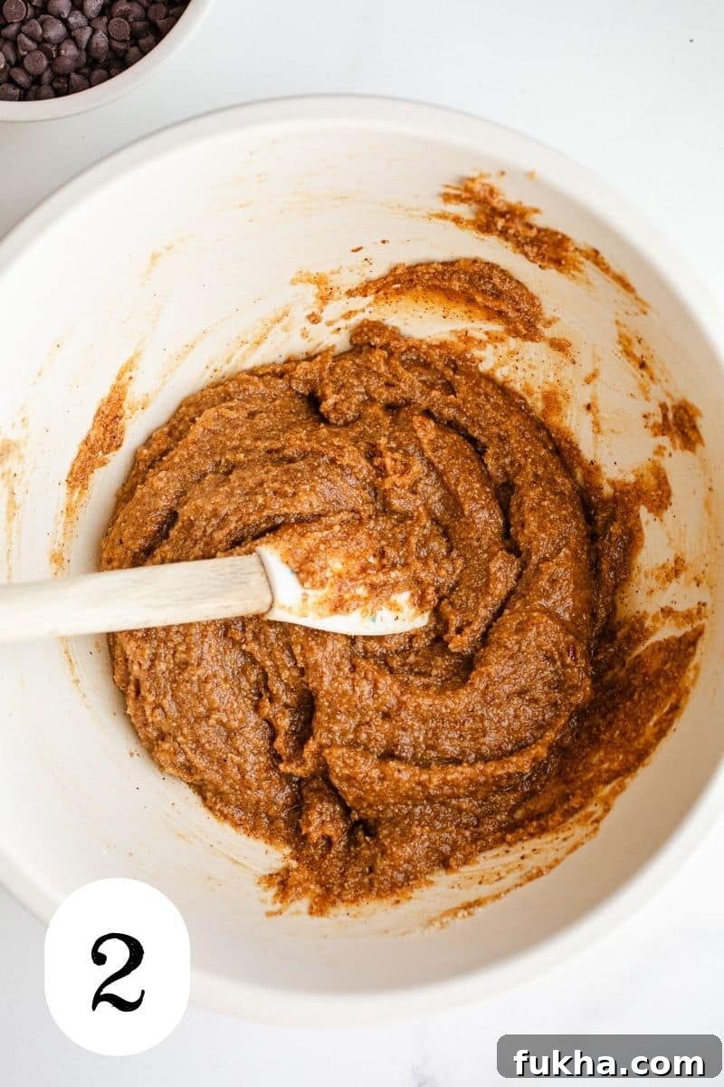 Almond cookie dough in a mixing bowl.