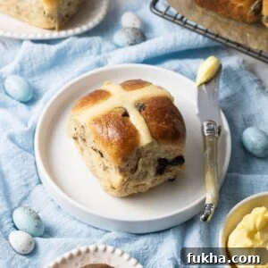Hot cross bun on plate