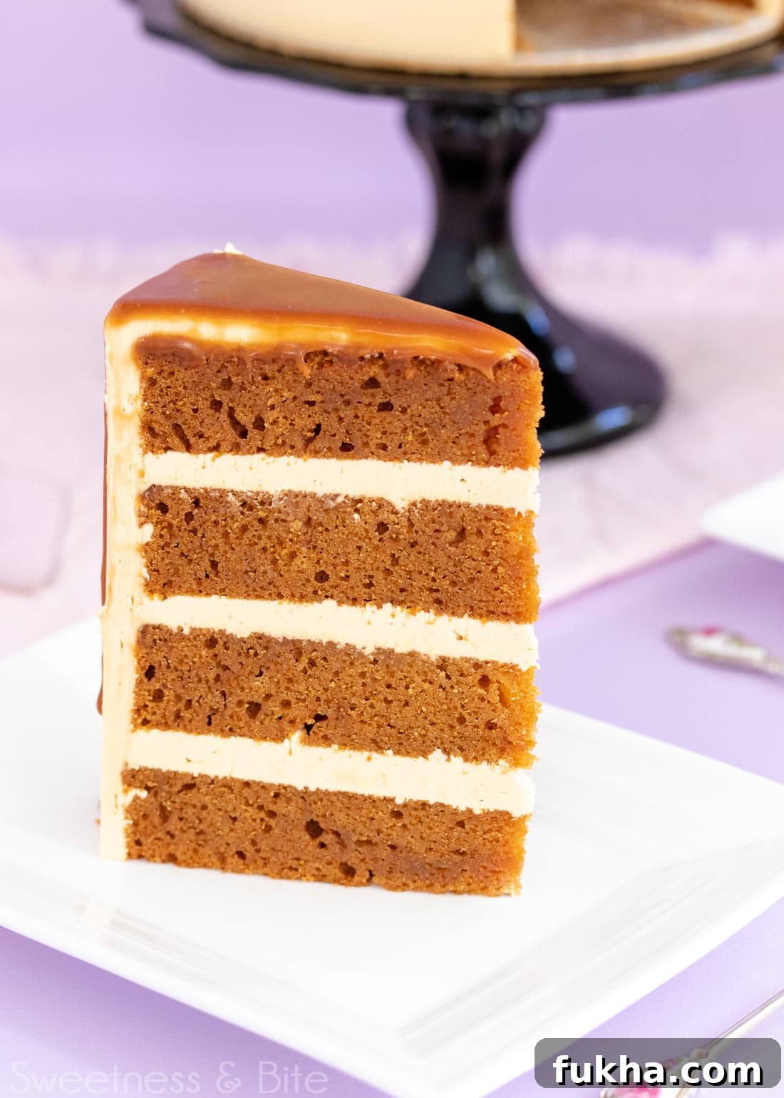 Decadent Caramel Mud Cake Recipe with Gluten Free Option 4 Close up of a slice of caramel mud cake with three layers of caramel buttercream.