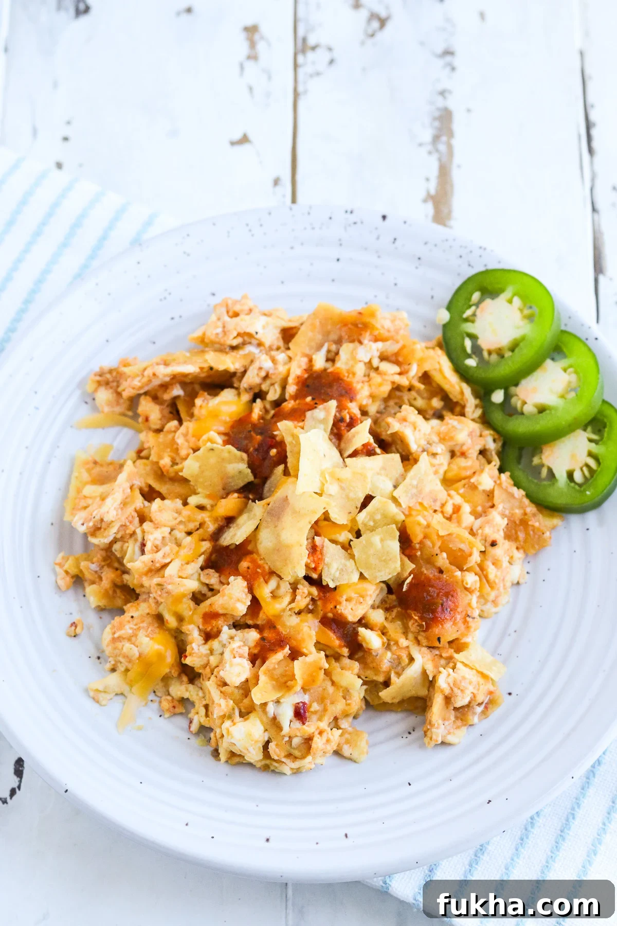 plate of cooked migas with jalapeno garnish