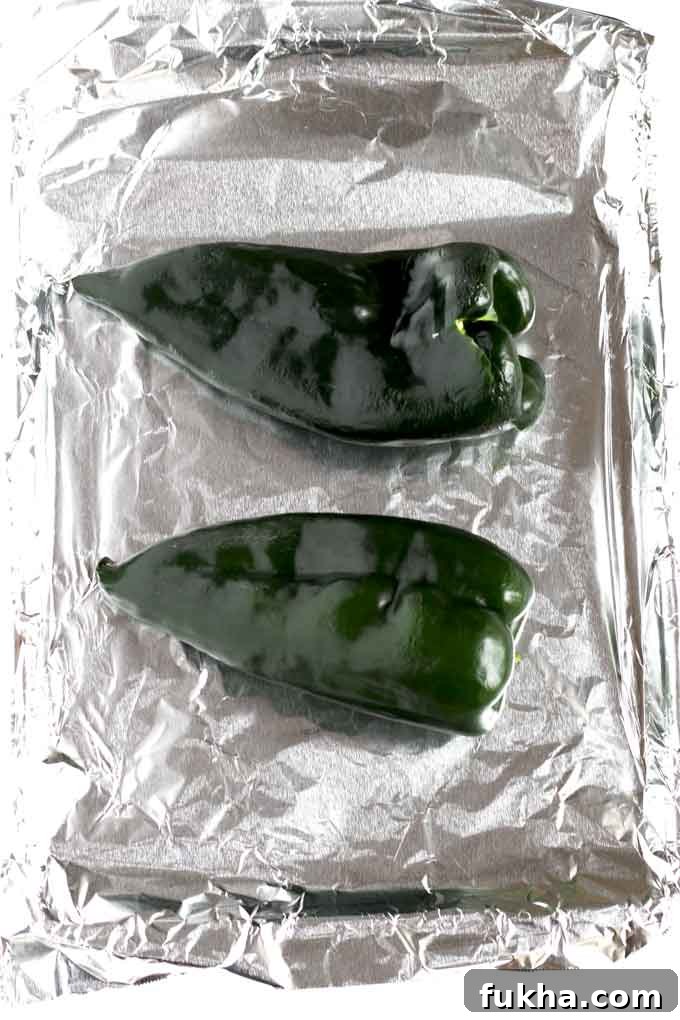 Poblano Peppers on a baking sheet.