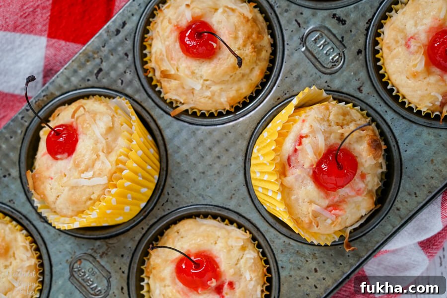 Malibu Muffins, muffins with pineapple, coconut, cherries, and rum flavoring.