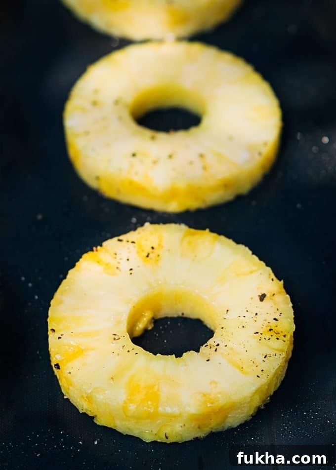 sliced pineapple on a nonstick grill mat