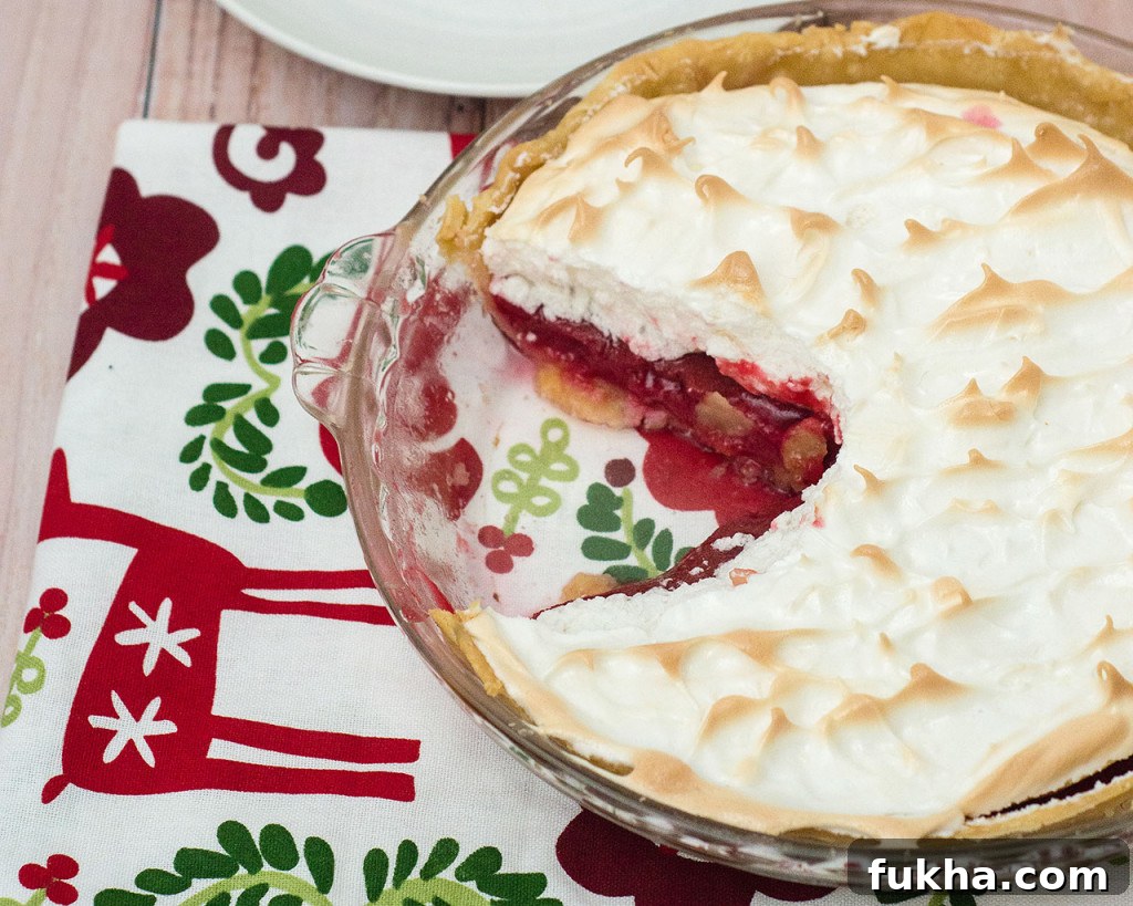 Cranberry Meringue Pie Recipe for a Tangy Holiday Dessert 2 Cranberry meringue pie with glossy peaks