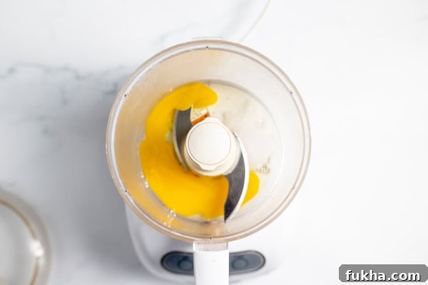 eggs, salt, and vinegar in a food processor bowl
