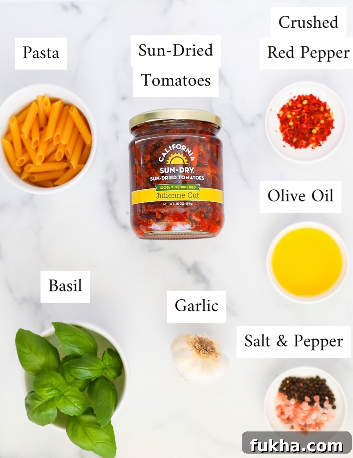 Sun Dried Tomato Pasta Recipe with Garlic and Basil 3 Labeled ingredients including: pasta, sun-dried tomatoes, crushed red pepper, olive oil, basil, garlic, salt, and pepper
