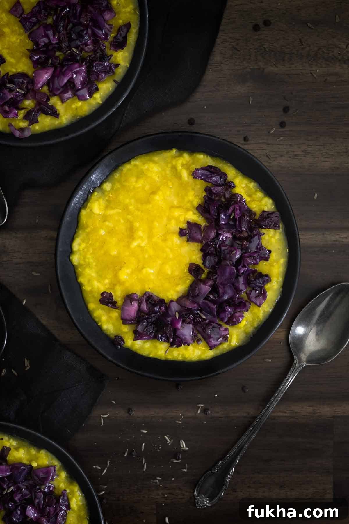 A bowl of rice and lentil porridge with red cabbage