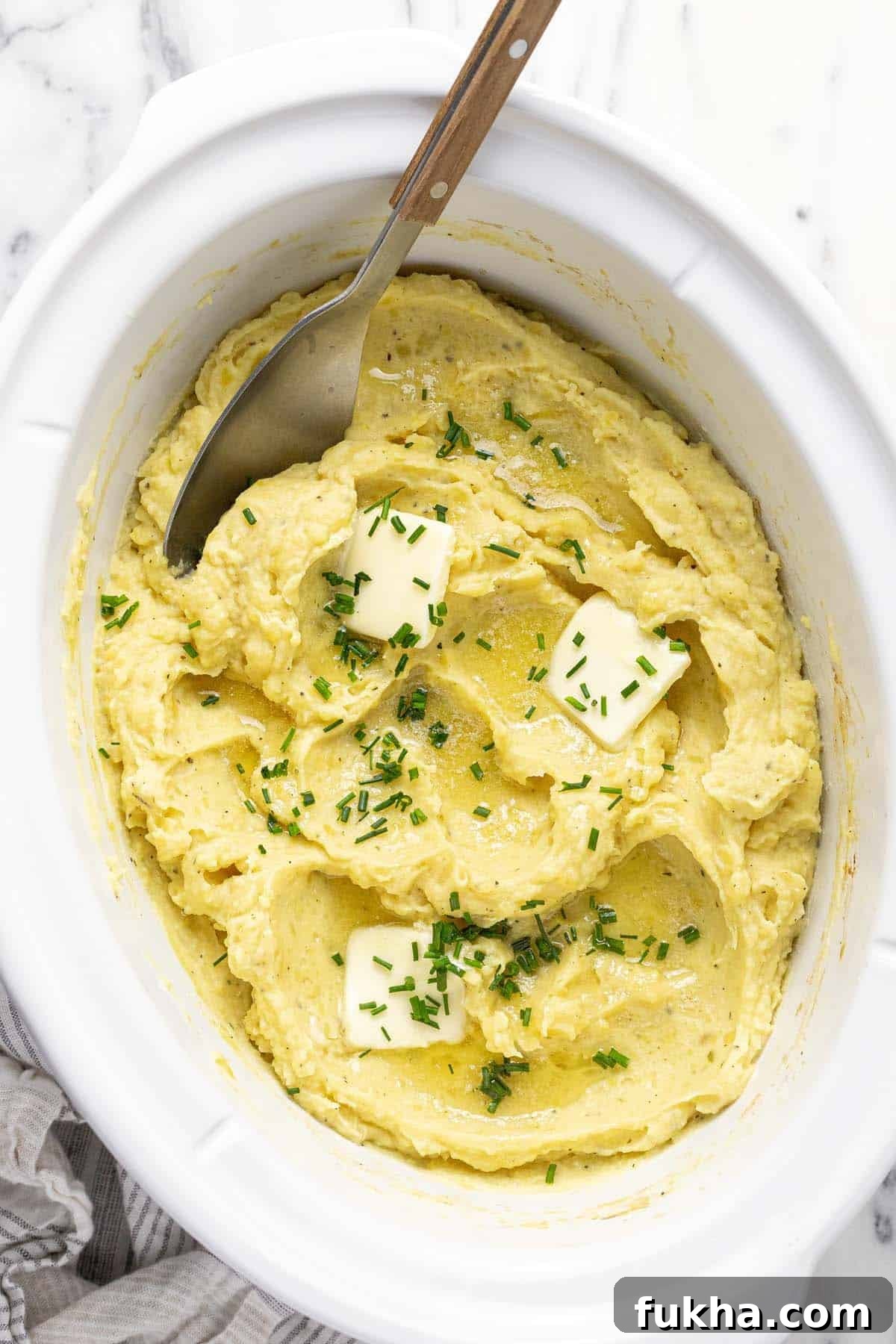 Creamy Slow Cooker Mashed Potatoes 2 Crock pot insert filled with creamy homemade mashed potatoes.