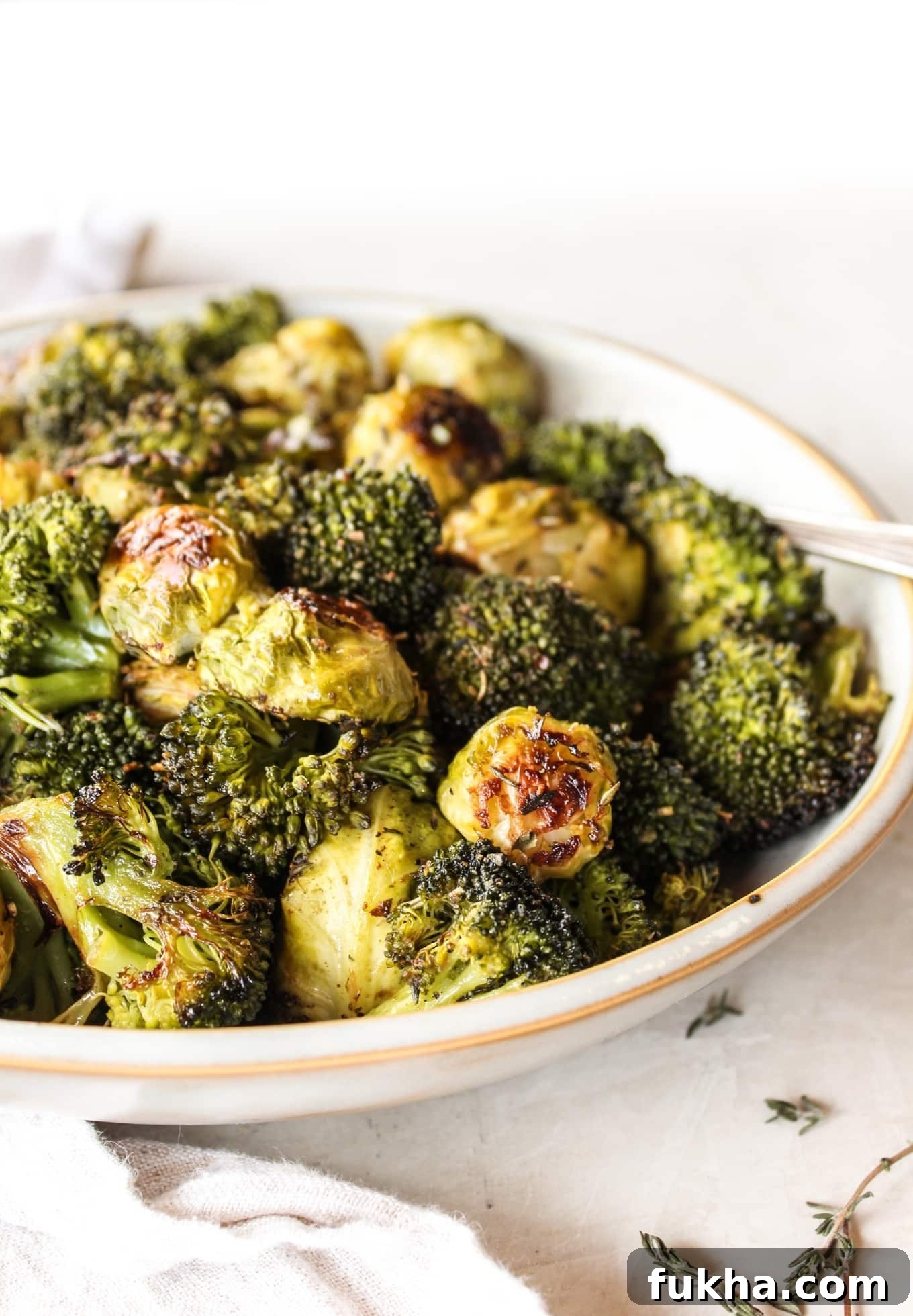 Crispy Herb-Roasted Brussels Sprouts and Broccoli 2 Herb roasted Brussels sprouts and broccoli on a sheet pan