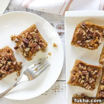 baked squares on white oblong platter and round plate