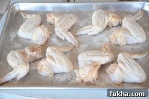Season wings with baking powder and spices