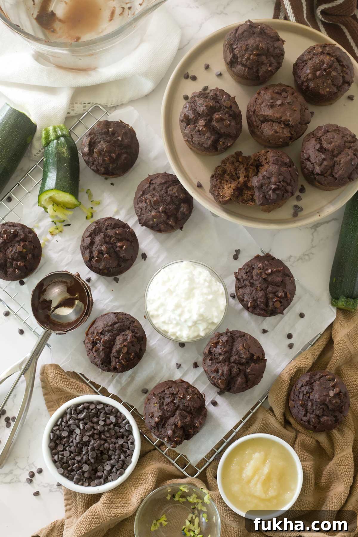 Fudgy Gluten Free Double Chocolate Zucchini Banana Muffins 11 Looking down on gluten-free double chocolate zucchini banana muffins on a cooling rack.