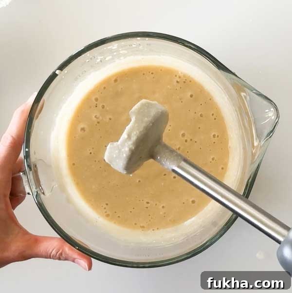 Fudgy Gluten Free Double Chocolate Zucchini Banana Muffins 7 Mixing the wet ingredients together with an immersion blender.