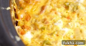 Crockpot Overnight Breakfast Casserole recipe is a classic make ahead breakfast casserole with eggs, sausage, bacon, hash browns, and cheese, Great for the holidays and a crowd.