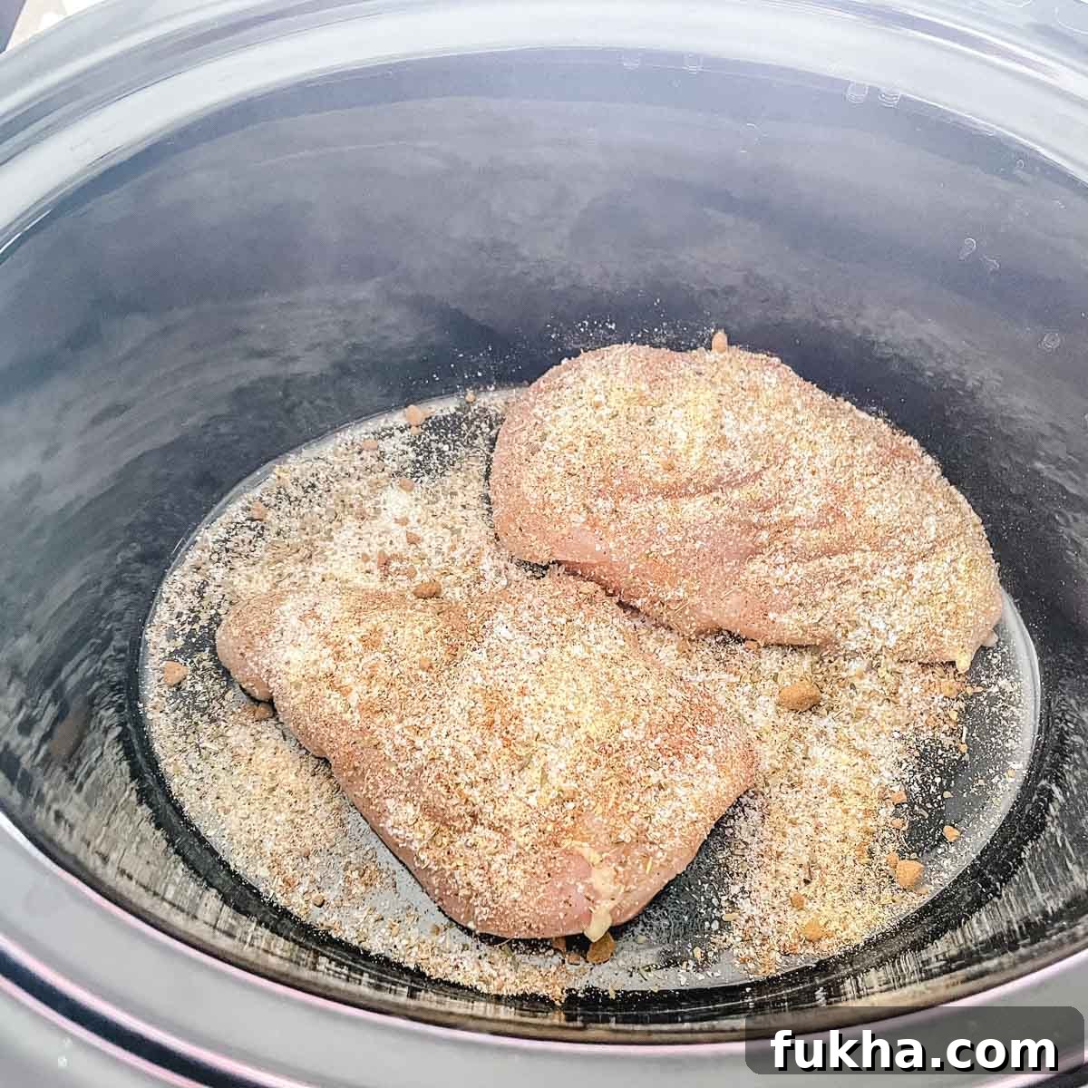 Slow Cooker Shredded Chicken Enchiladas 6 Spices are added to the chicken.