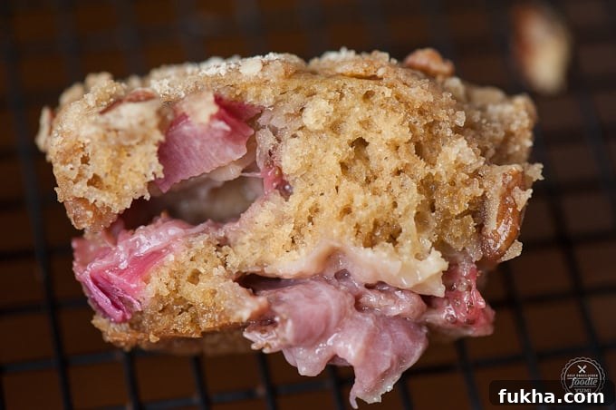 baked Muffin made with strawberries and rhubarb split in half