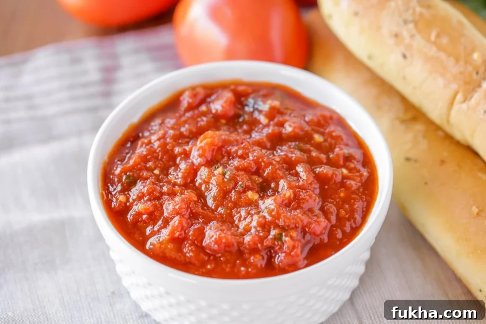 Marinara sauce in a small white bowl.
