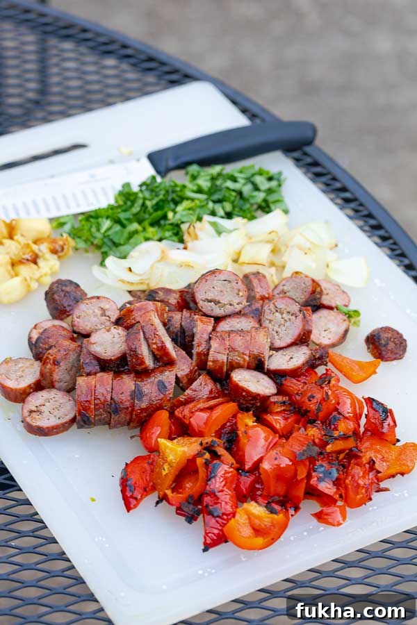 Grilled Italian Sausage Pasta 5 cutting board of roasted ingredients for grilled salsiccia pasta