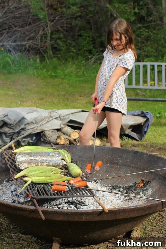 Campfire Banana Boat Recipe for Kids 3 Roasting sausages to eat before the Banana Boats
