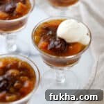 Swedish Fruit Soup topped with whipped cream.