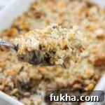 Close up of a spoonful of Mushroom Gratin.