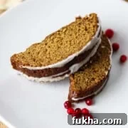 Close up of slices of Swedish Spice Cake with lingonberries.