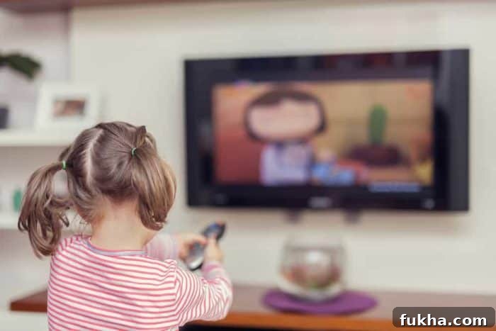 4 Practical Steps When You Can't Make Ends Meet 3 Photo shows a young girl with pigtails holding a remote and watching TV